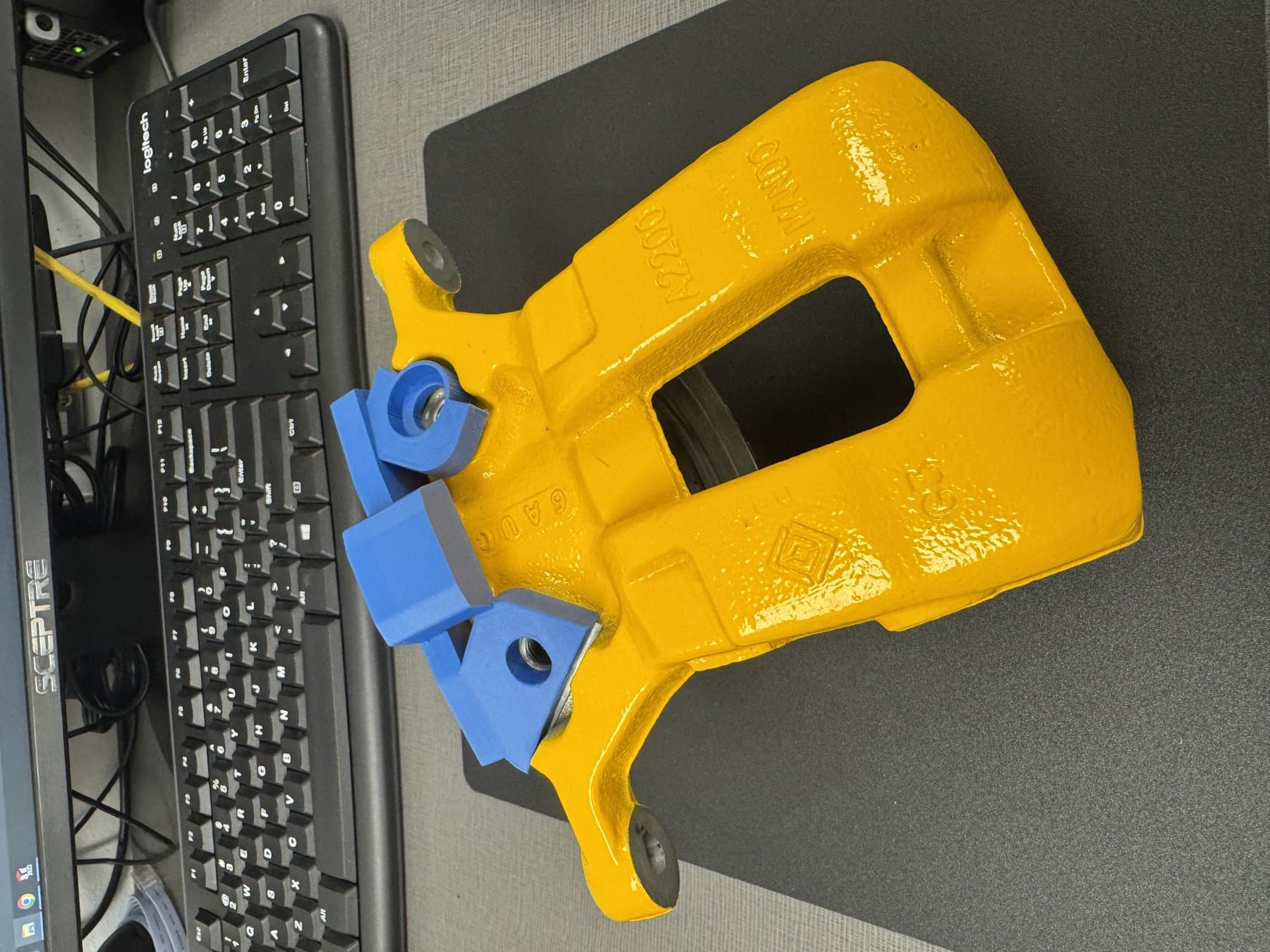 3D printed masking bracket insert installed on the part